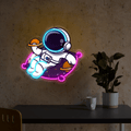 Cute Astronaut Holding Planet Artwork LED neon sign by NeonCS