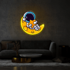 Cute Astronaut Lay on Moon Cartoon LED neon sign by NeonCS